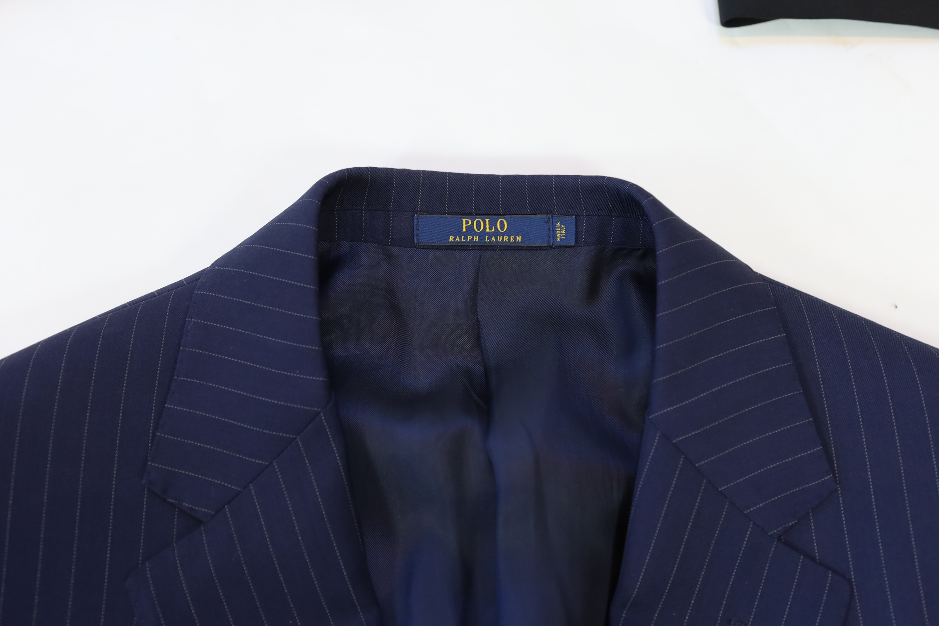 A Yves Saint Laurent, a Gucci and a Boss men's suits and Ralph Lauren and Emporio Armani jacket